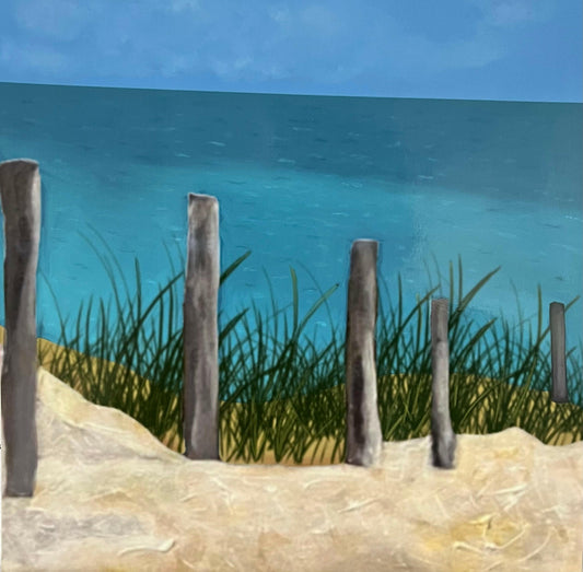 A serene beach print depicting weathered wooden posts along a sandy dune with sea grass, overlooking a calm turquoise ocean and a clear blue sky.