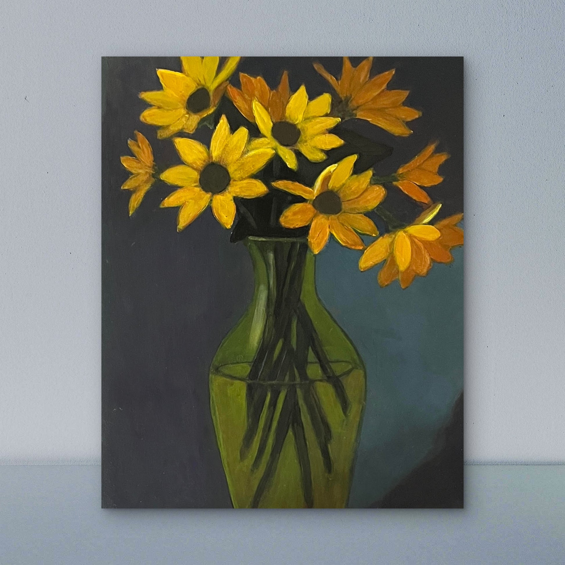 Sunflowers in a green glass vase